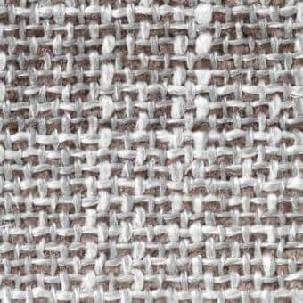 Tweed-like fabric texture in light gray and muted brown tones features an irregular, heathered weave with looped yarns.